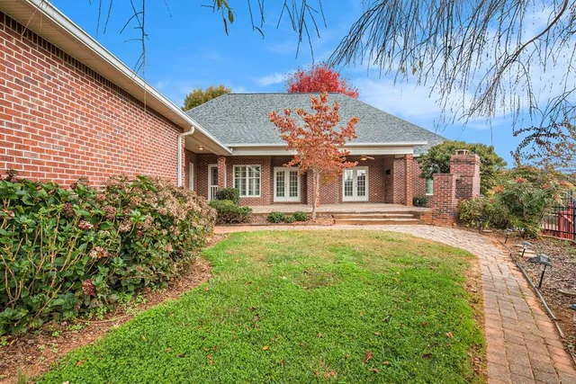 a front view of a house with garden