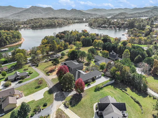 an aerial view of lake residential house with outdoor space and river