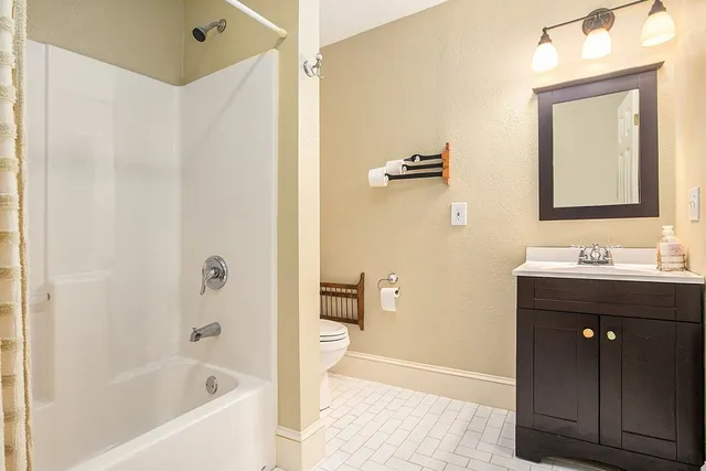 a bathroom with a bathtub and a sink