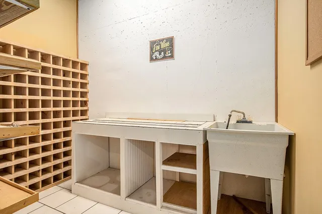 a close view of a sink a toilet and a mirror