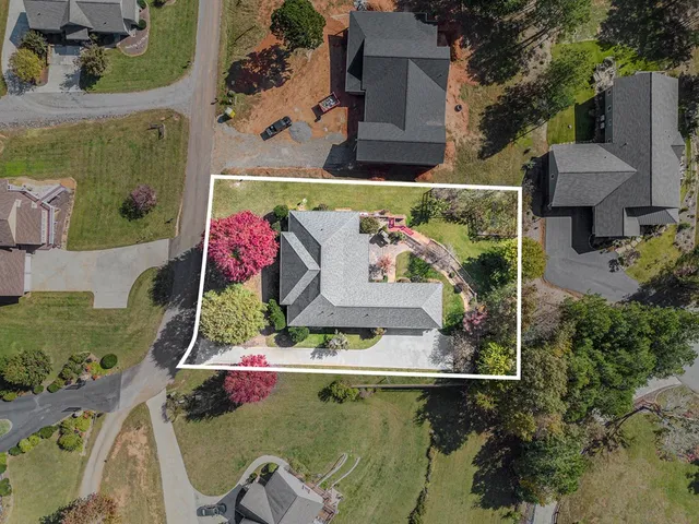 an aerial view of a house with outdoor space