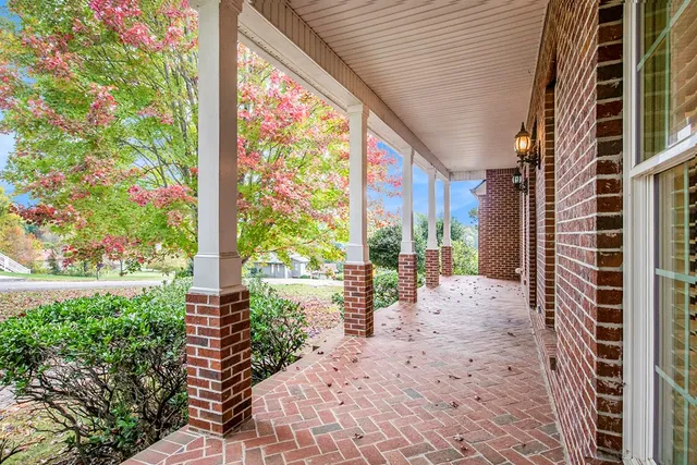 a view of a chairs and table in the patio