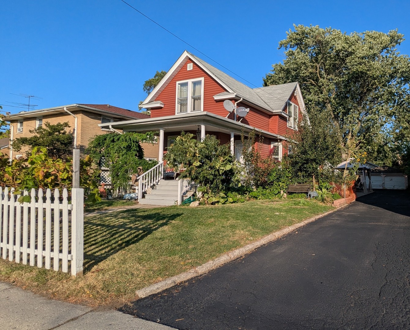 23 North Jackson Street Waukegan, IL 60085 - Photo 1 of 26 a front view of a house with garden