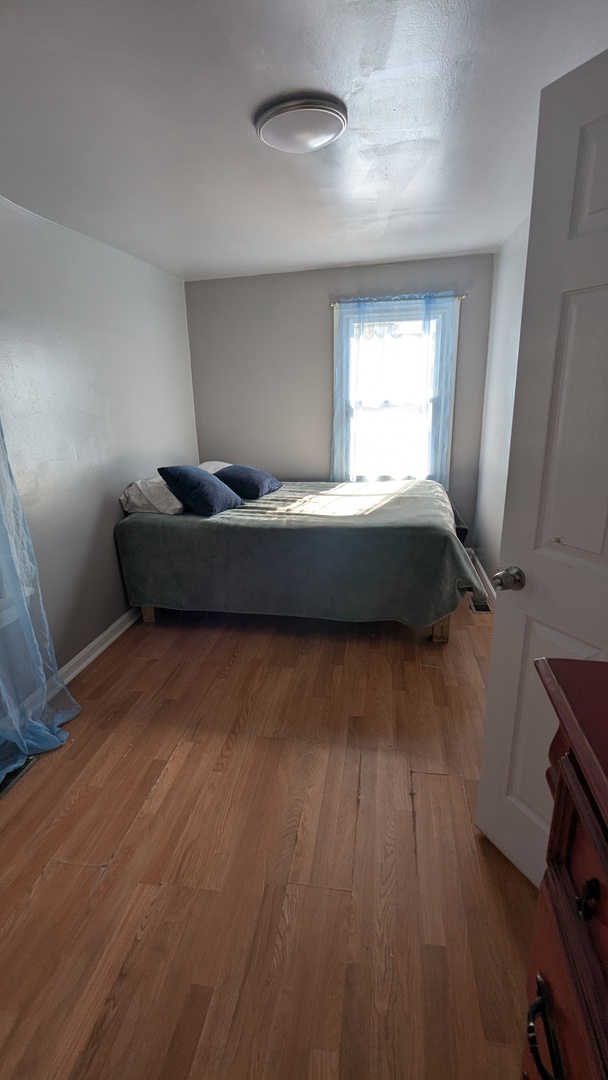 23 North Jackson Street Waukegan, IL 60085 - Photo 13 of 26 a living room with furniture and a wooden floor