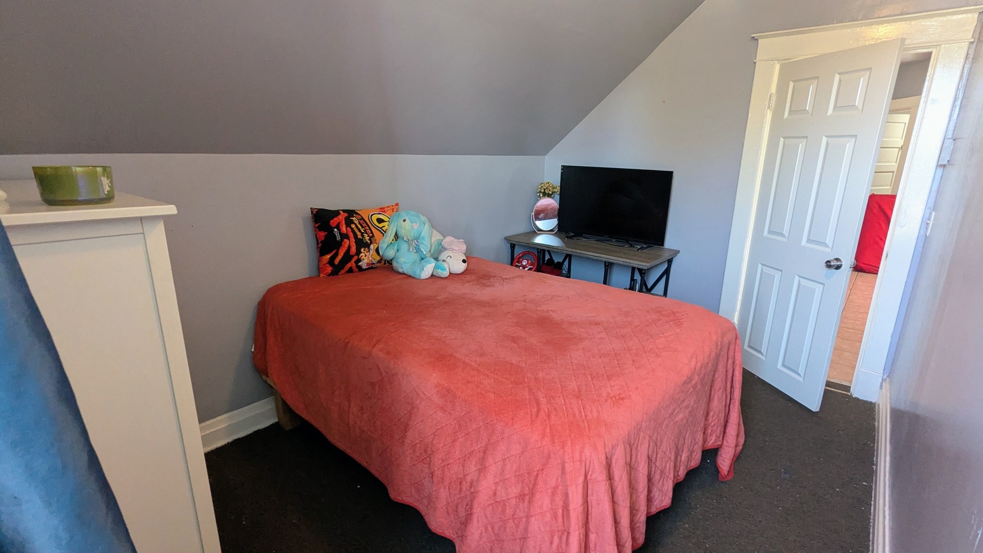 23 North Jackson Street Waukegan, IL 60085 - Photo 14 of 26 a bedroom with a bed and a flat screen tv