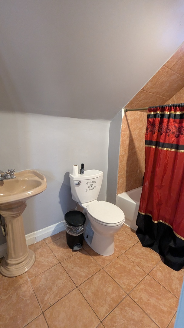 23 North Jackson Street Waukegan, IL 60085 - Photo 21 of 26 a bathroom with a toilet and a sink