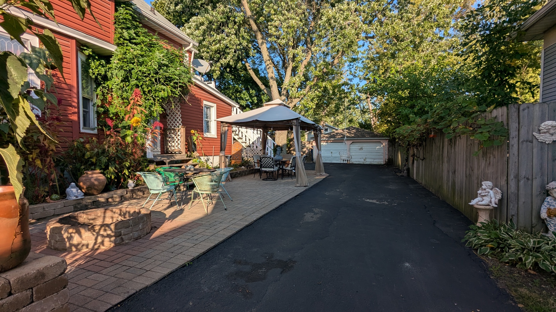 23 North Jackson Street Waukegan, IL 60085 - Photo 4 of 26 a view of a patio with table and chairs and potted plants
