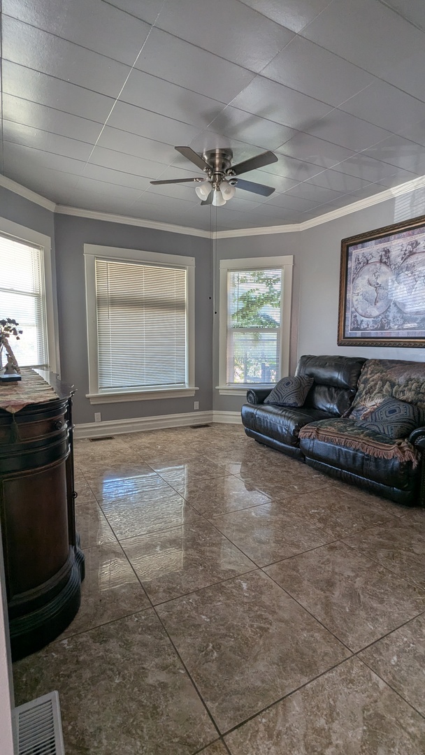 23 North Jackson Street Waukegan, IL 60085 - Photo 7 of 26 a living room with furniture and a fireplace
