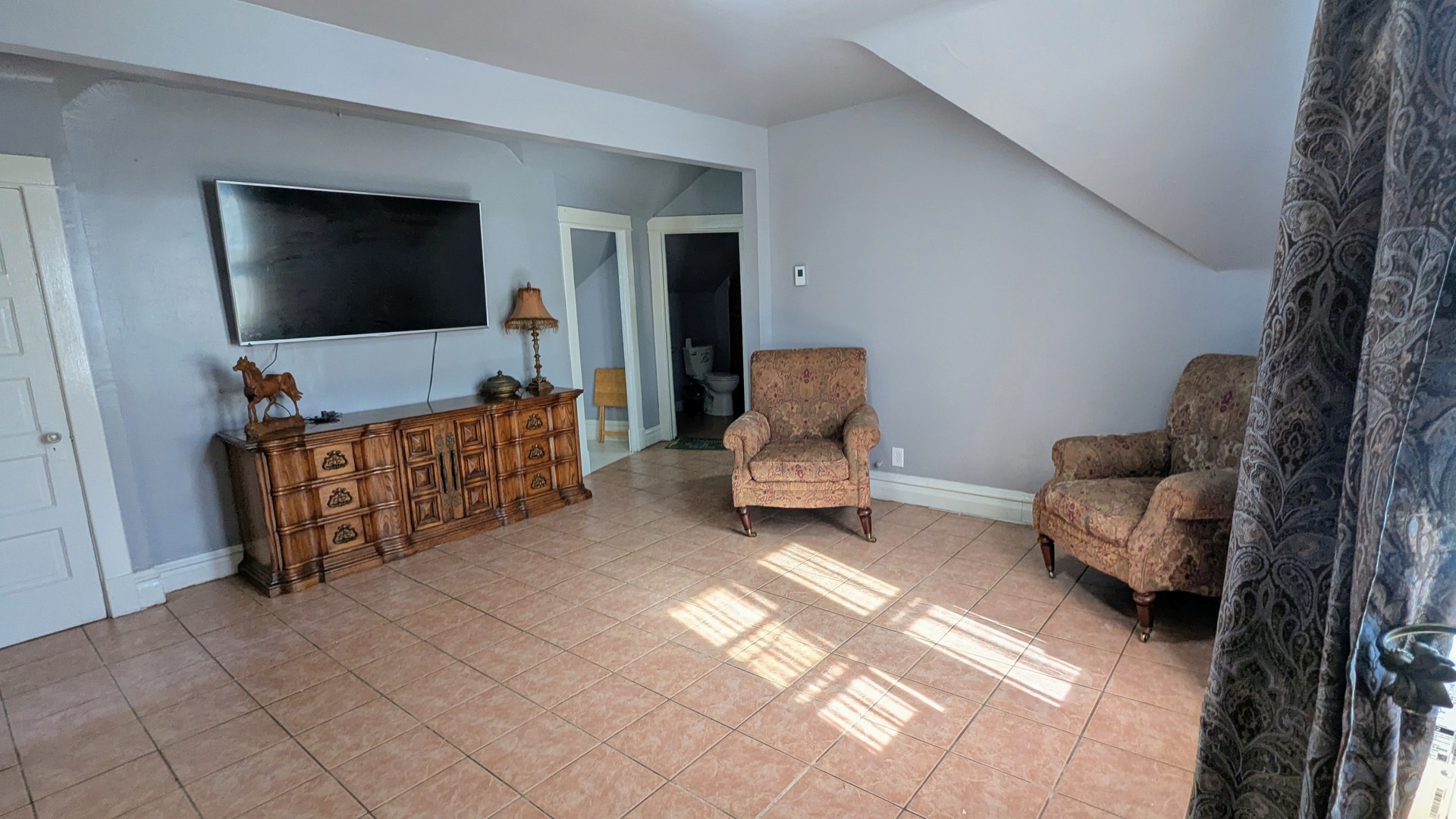 23 North Jackson Street Waukegan, IL 60085 - Photo 8 of 26 a living room with furniture and a flat screen tv