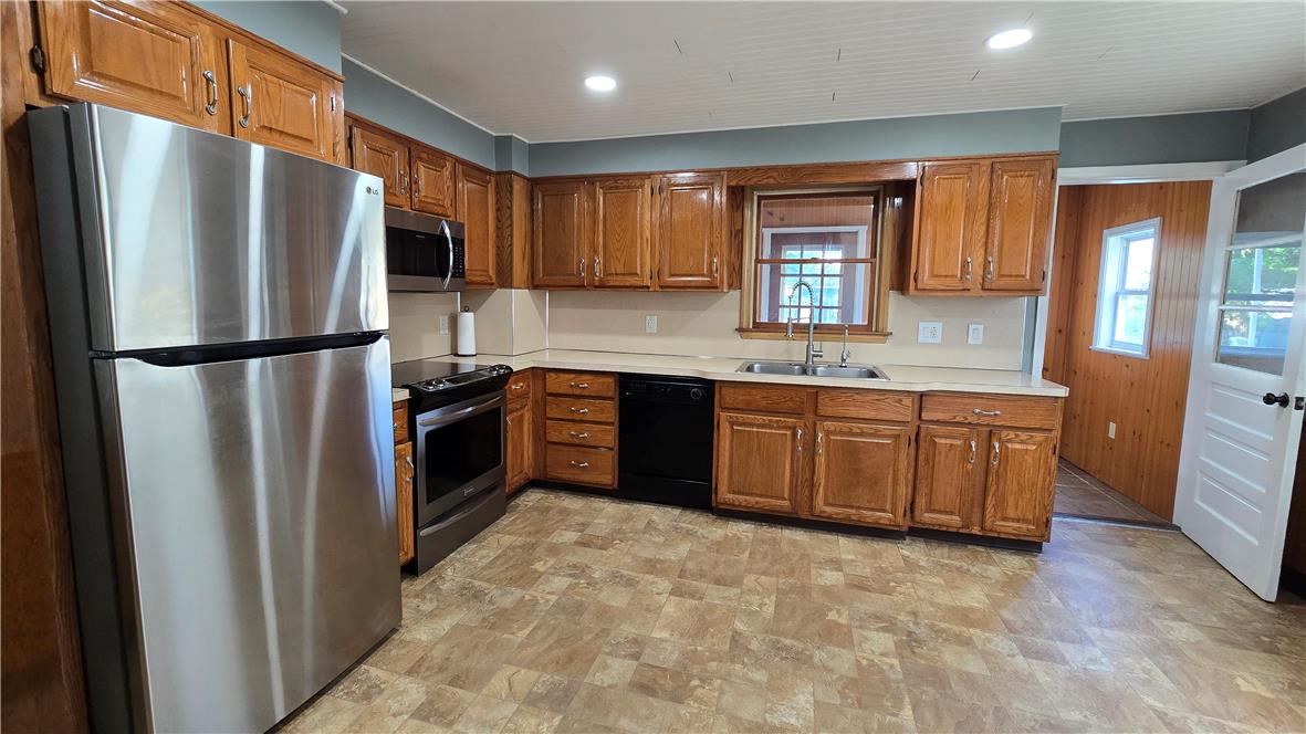 883 North Locust Street Hazleton, PA 18201 - Photo 18 of 83 A well-equipped kitchen featuring warm wooden cabinetry and durable flooring awaits culinary adventures.