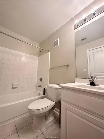 a bathroom with a sink a toilet and a bathtub