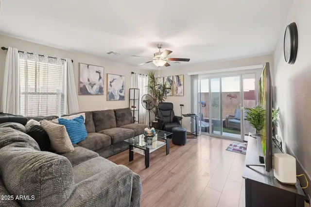 a living room with furniture and a large window