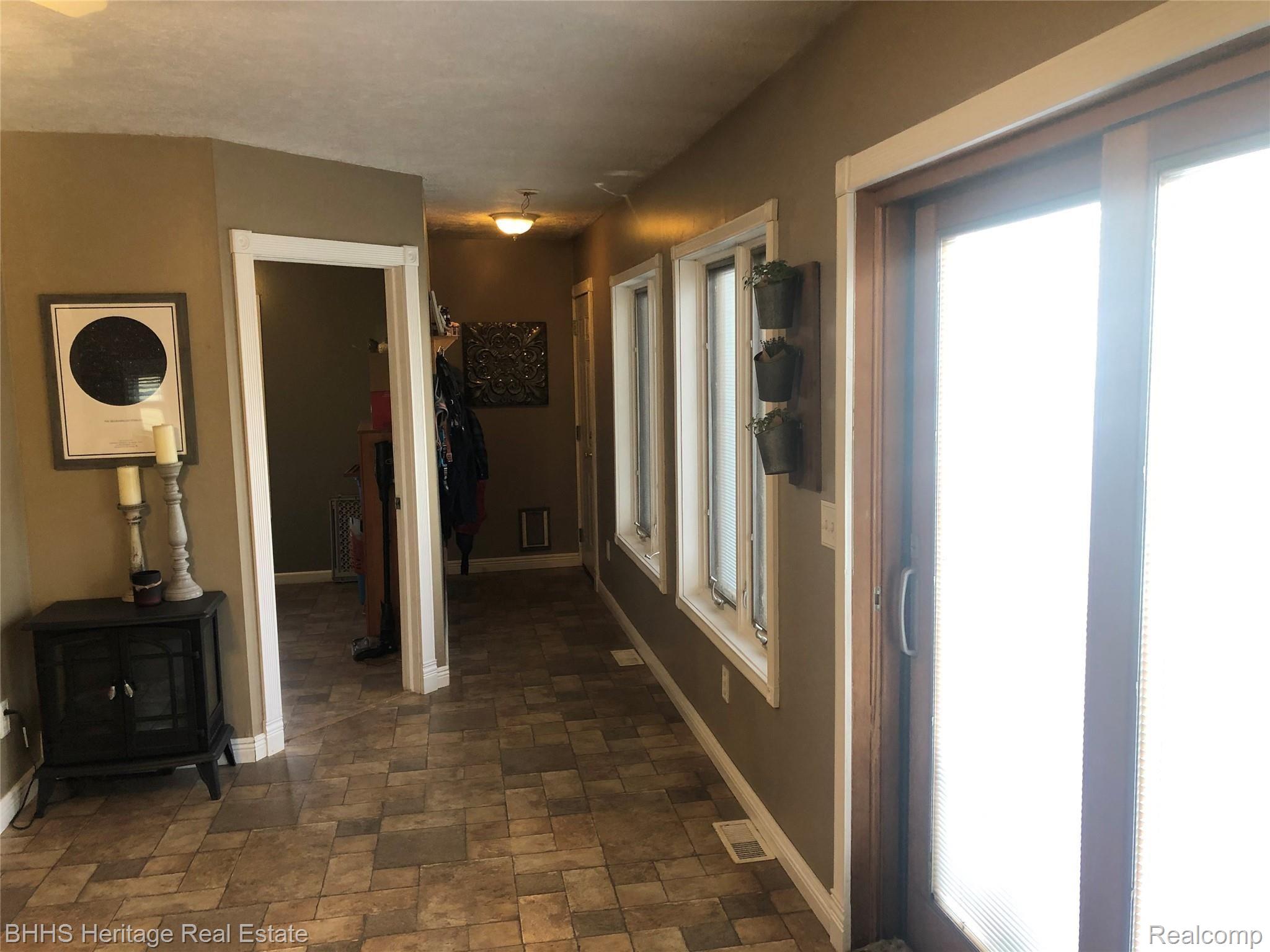 4564 Van Atta Road Okemos, MI 48864 - Photo 16 of 21 hallway to the garage