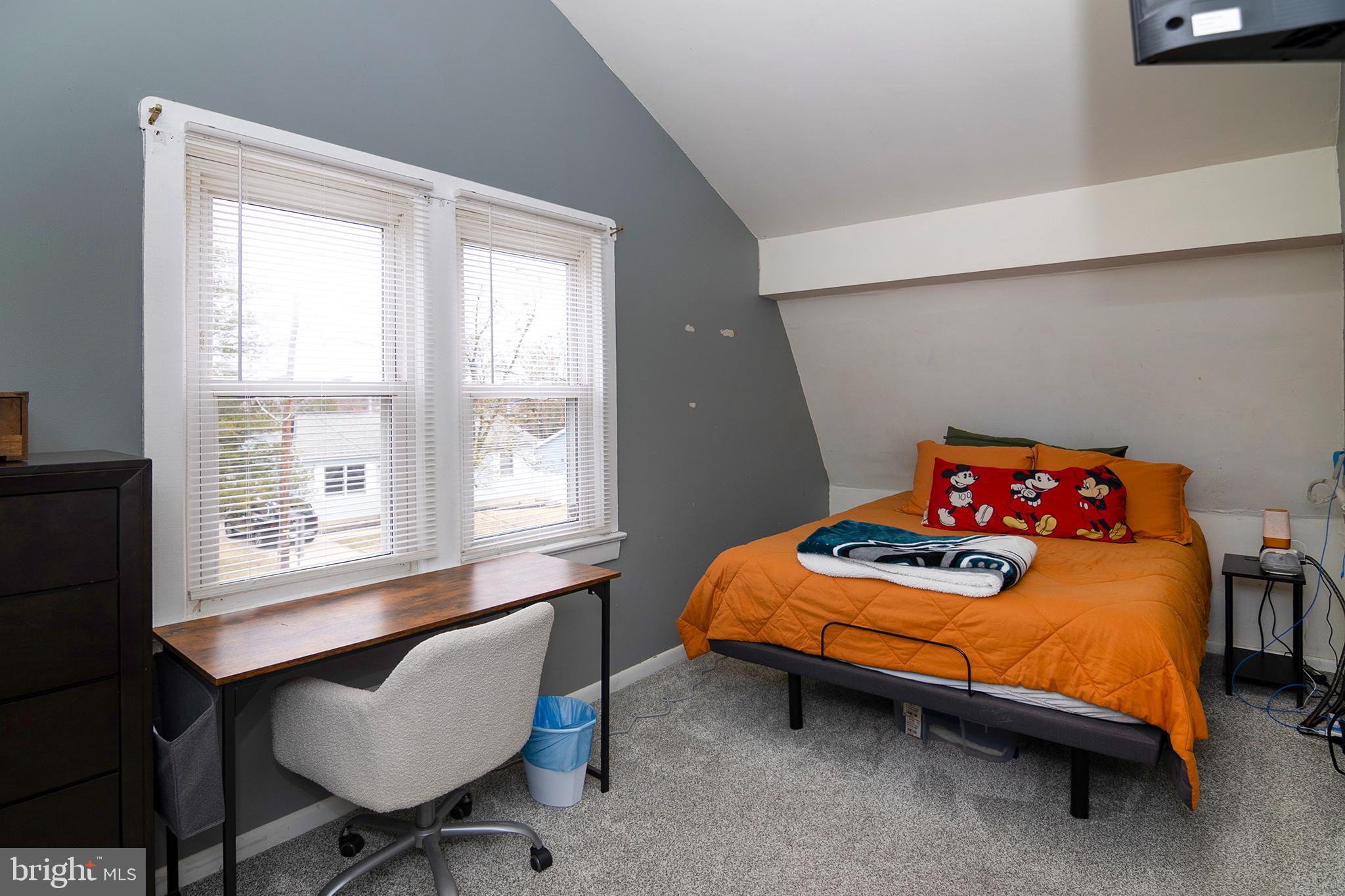 211 Chestnut Street Glendora, NJ 08029 - Photo 13 of 34 a bedroom with a bed and a chair