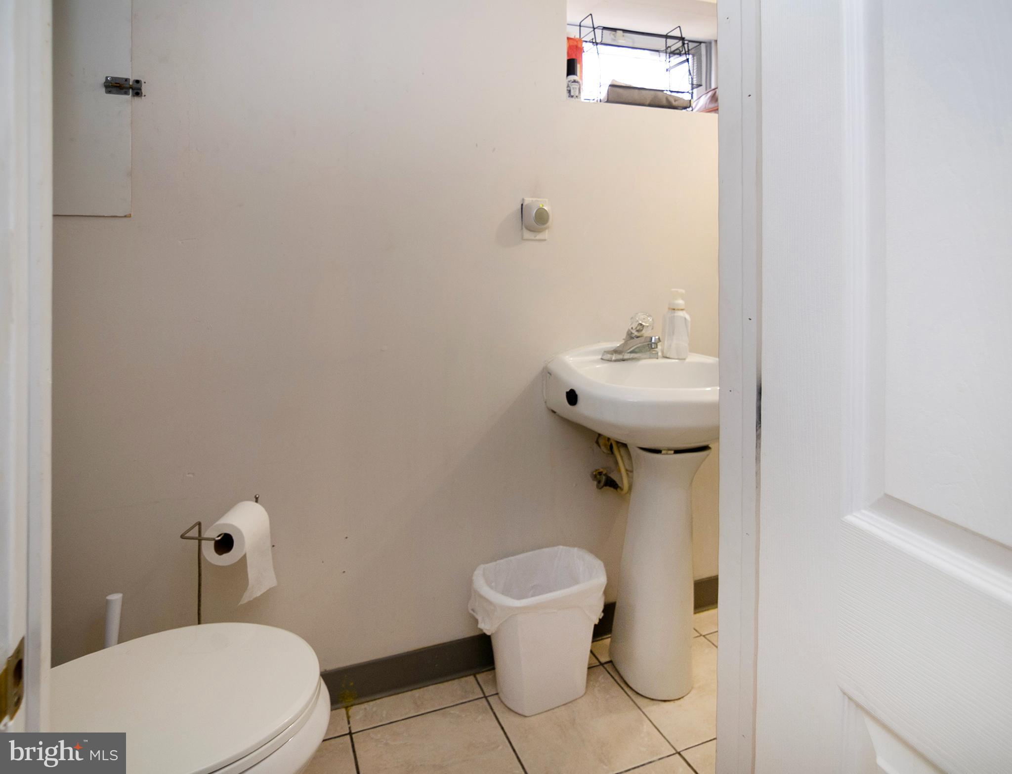 211 Chestnut Street Glendora, NJ 08029 - Photo 25 of 34 a bathroom with a toilet and a sink