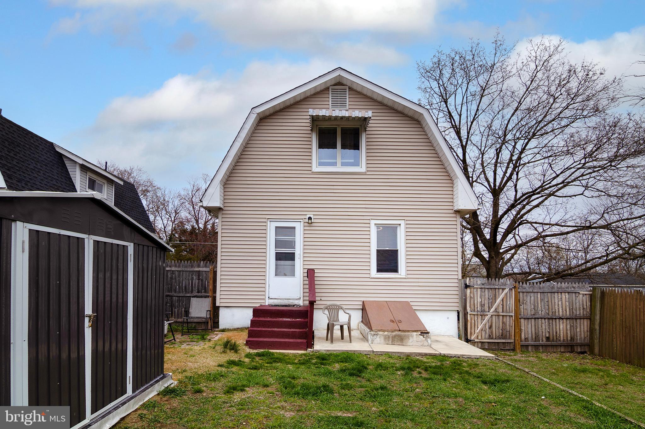 211 Chestnut Street Glendora, NJ 08029 - Photo 28 of 34 a front view of a house with garden
