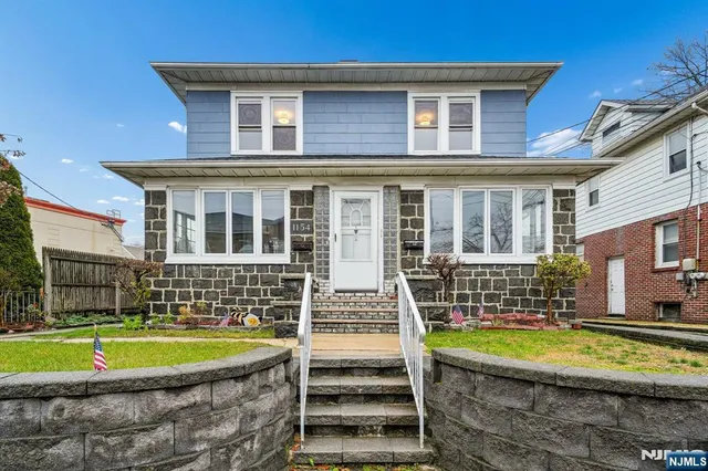 a view of house with a swimming pool