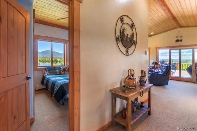 a view of a livingroom with furniture and a window