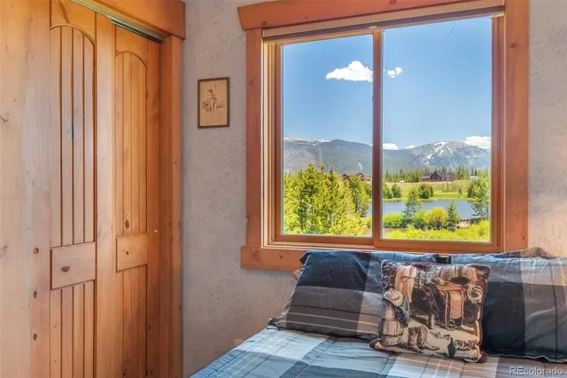 a view of a bedroom with furniture and windows
