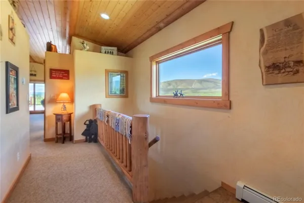 a view of a hallway with workspace