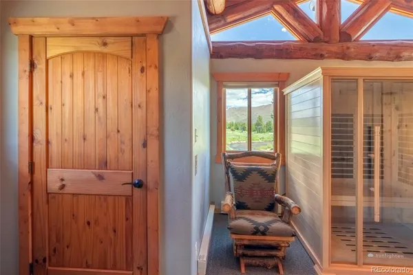 a hallway with couch and a entryway