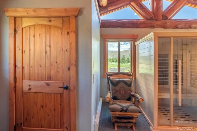 a hallway with couch and a entryway