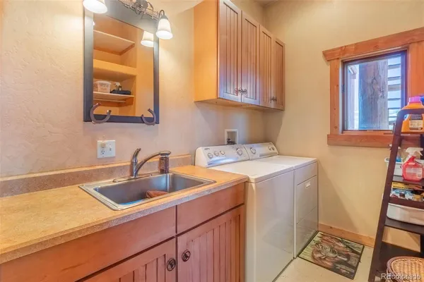 a view white cabinets and sink