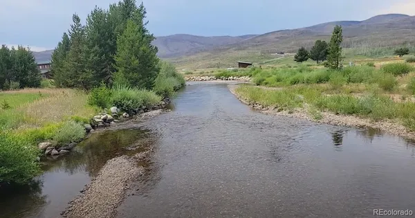 a view of a lake with mountains in front of it