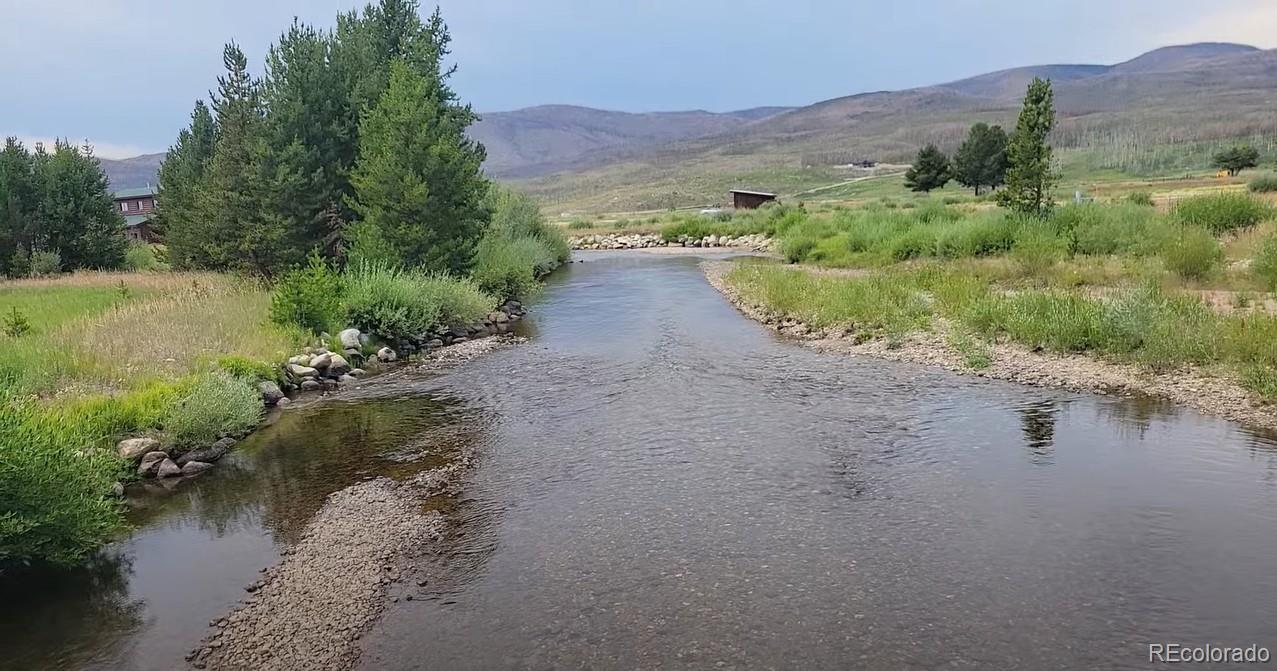 1443 Gcr 49 Grand Lake Grand Lake, CO 80447 - Photo 5 of 50 a view of a lake with mountains in front of it
