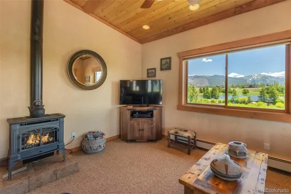 a view of a livingroom with furniture and a flat screen tv