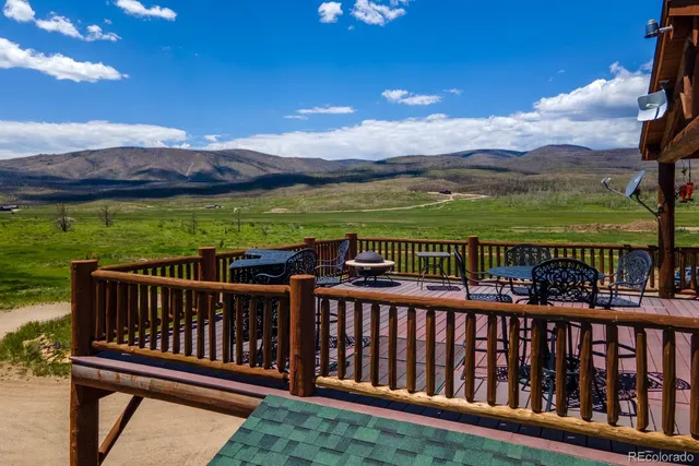a view of a two chairs on the roof deck