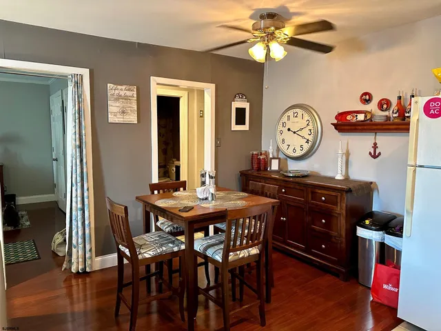 a view of a dining room and a table and chairs