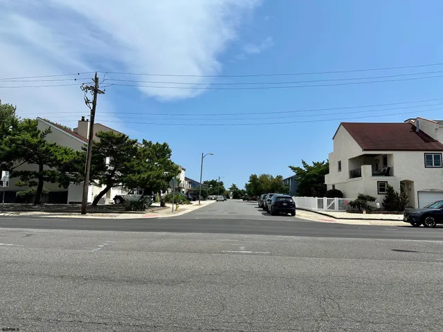 a view of street with tall buildings
