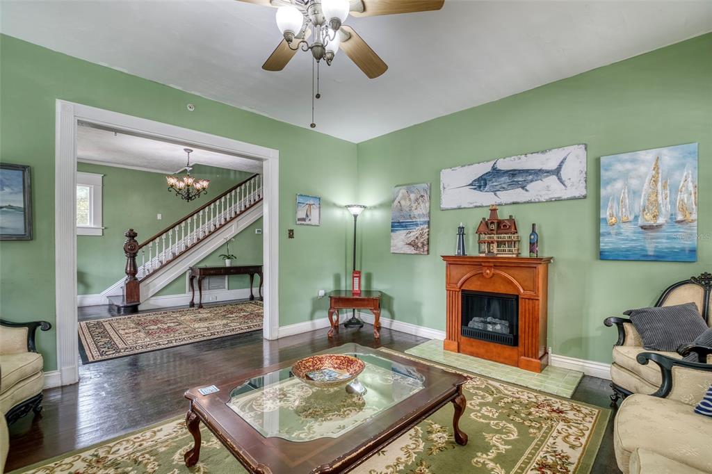 304 15th Street West Bradenton, FL 34205 - Photo 14 of 75 a living room with furniture and a fireplace