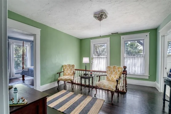 a bed room with a bed and a chandelier