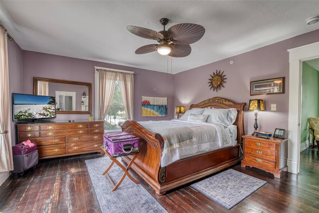 304 15th Street West Bradenton, FL 34205 - Photo 37 of 75 a bedroom with a bed and wooden floor