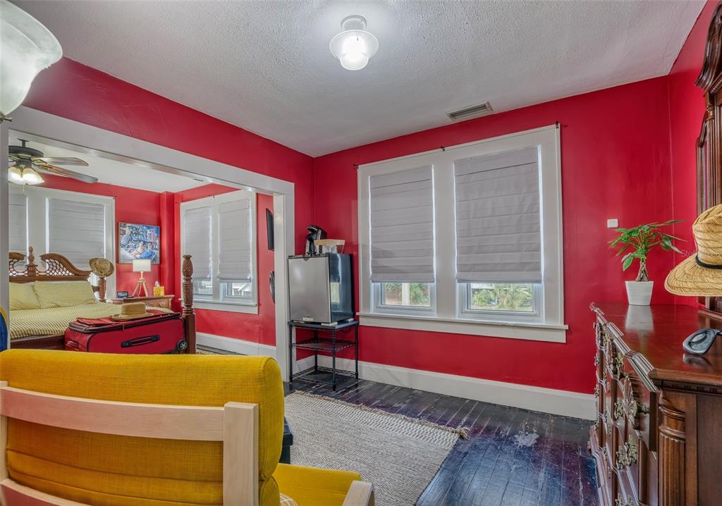 304 15th Street West Bradenton, FL 34205 - Photo 43 of 75 a living room with furniture and a floor to ceiling window