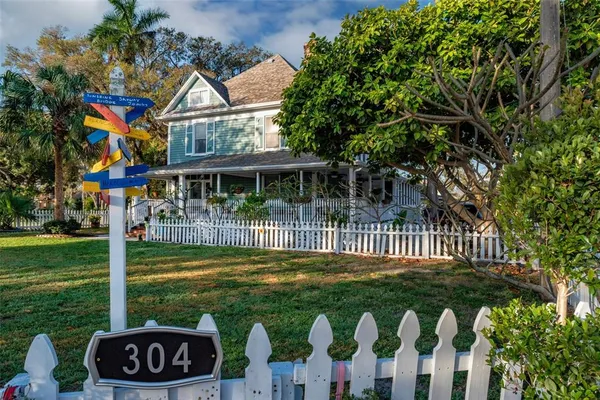 a view of a patio with table and chairs and wooden floor