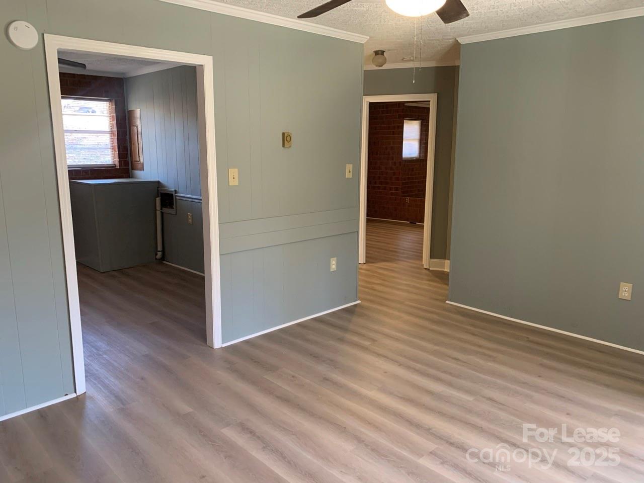 8544 Babe Drive Terrell, NC 28682 - Photo 17 of 20 a view of a hallway with wooden floor and a cabinet