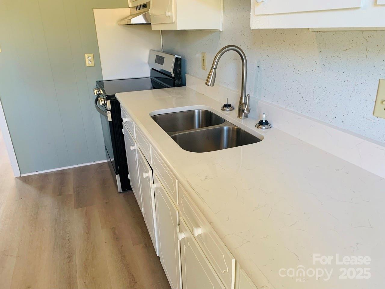 8544 Babe Drive Terrell, NC 28682 - Photo 2 of 20 a close view of a sink and dishwasher in a kitchen