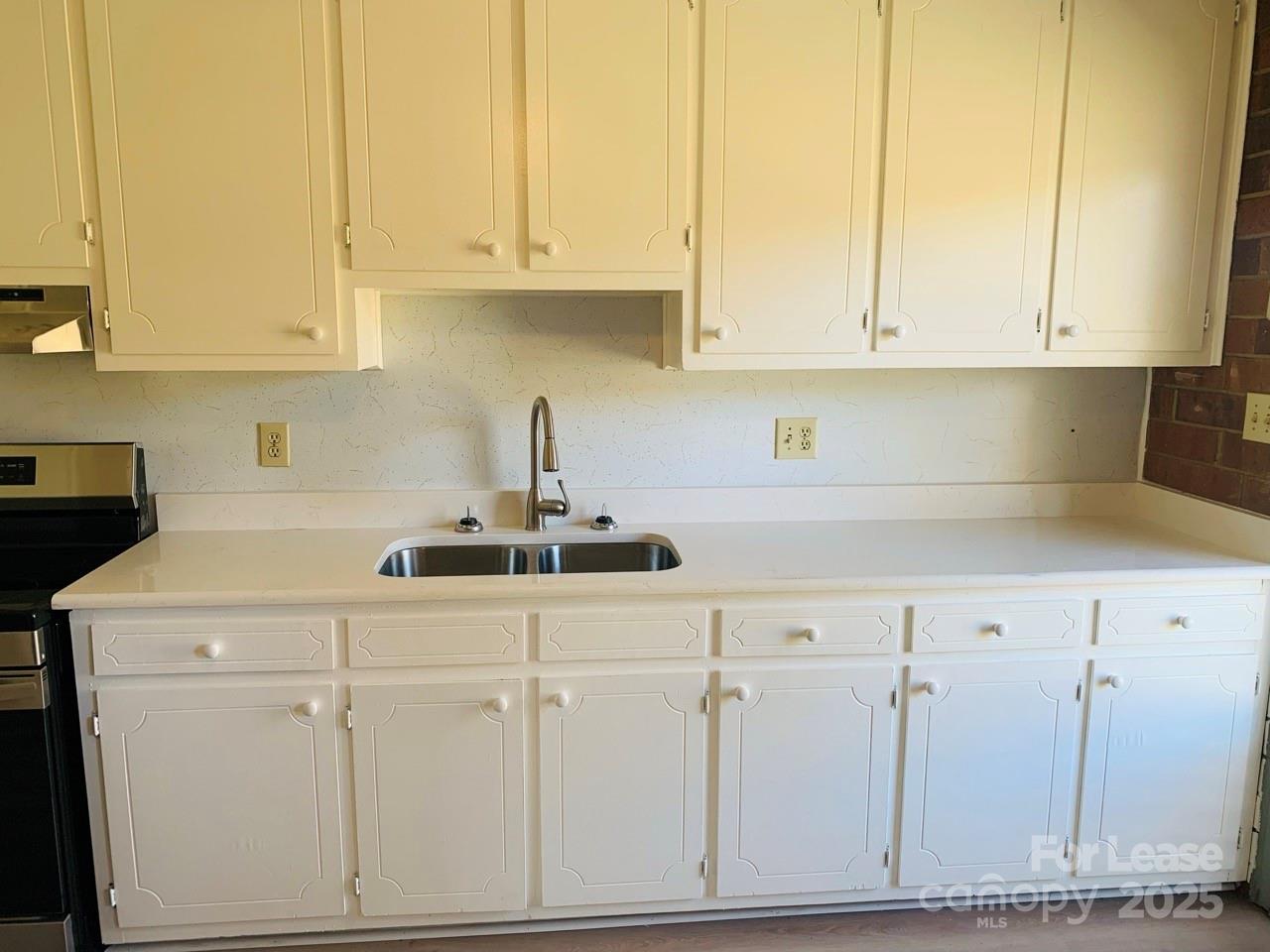 8544 Babe Drive Terrell, NC 28682 - Photo 5 of 20 a kitchen with stainless steel appliances white cabinets and a sink