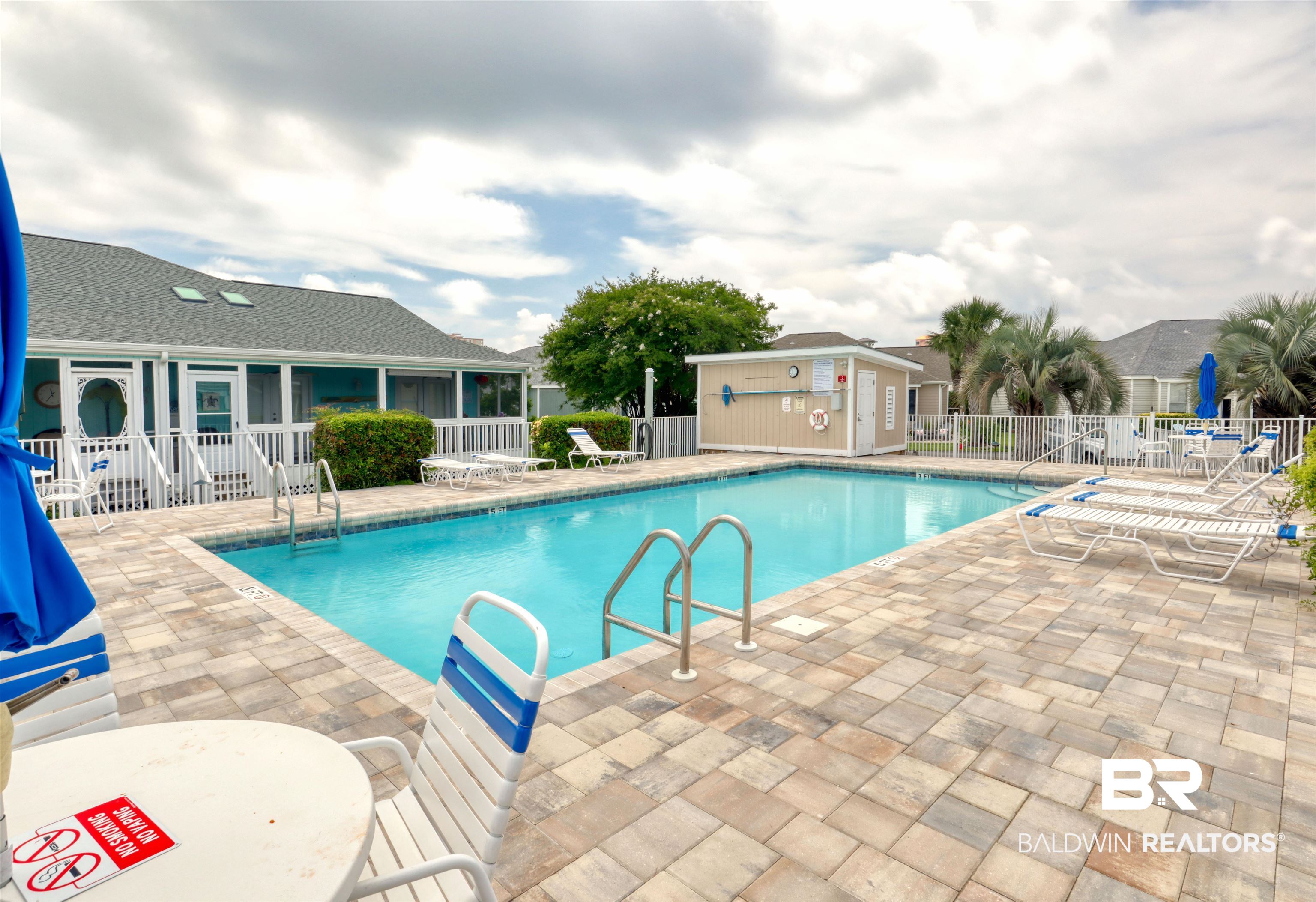 3200 Loop Road, Unit 61 Orange Beach, AL 36561 - Photo 22 of 32 Community pool featuring a patio