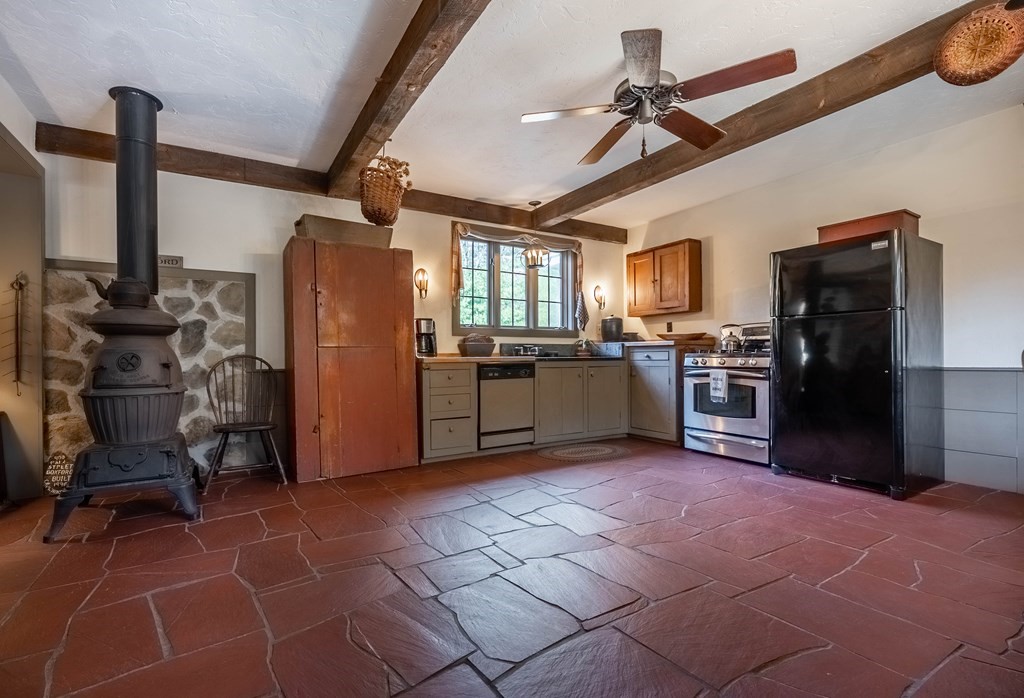 400 Main Street Boxford, MA 01921 - Photo 13 of 34 a kitchen with stainless steel appliances granite countertop a refrigerator and a stove