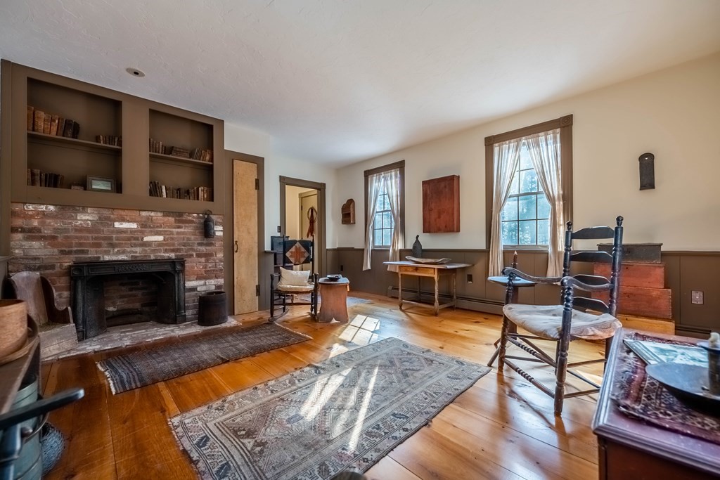 400 Main Street Boxford, MA 01921 - Photo 17 of 34 a living room with furniture and a fireplace