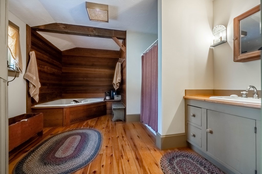 400 Main Street Boxford, MA 01921 - Photo 29 of 34 a bathroom with a sink a mirror and bathtub