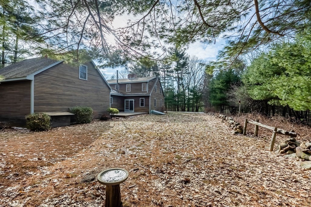 400 Main Street Boxford, MA 01921 - Photo 4 of 34 a backyard of a house with table and chairs