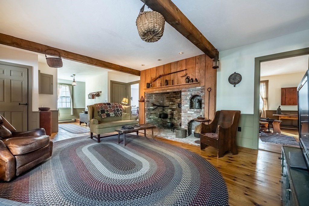 400 Main Street Boxford, MA 01921 - Photo 9 of 34 a living room with furniture and a fireplace