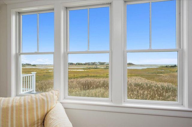 a view of a room that has a bed