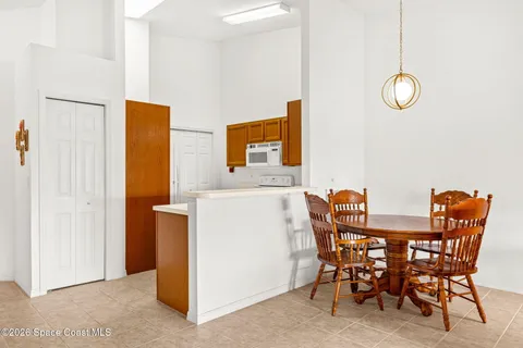 a kitchen with a sink stove and refrigerator