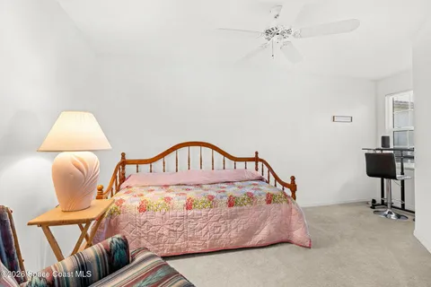 a bedroom with furniture and a window